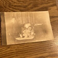 Vintage RPPC Postcard Little Boy with Baby in High Chair  picture