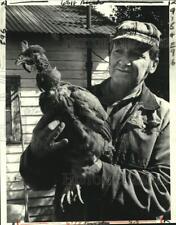 1980 Press Photo Joseph Mouton Holds One Of His Turkey-Chicken Hens, Bridge City picture