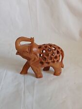 Hand carved wooden elephant with baby elephant inside figurine trunk UP picture