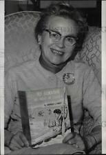 1966 Press Photo Gertrude E. Finney with her book To Survive We Must Be Clever picture