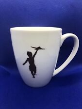 White Storyville Coffee Company Mug “YOUNG BOY RUNNING w/ TOY PLANE” Silhouette  picture