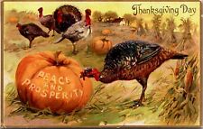 Thanksgiving Day Greetings PC Turkey Pecking Peace and Prosperity Into Pumpkin picture