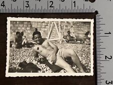 WWII SOLDIERS ENJOYING FRENCH RIVIERA BEACH WITH STONES AND NO SAND PHOTOGRAPH picture