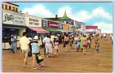 1940-50's REHOBOTH BEACH DE BOARDWALK DILL'S TAFFY NOXZEMA DOLLES SIGNS POSTCARD picture