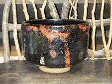 Traditional Japanese Raku ware tea bowl with chips picture