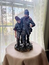 This stunning statue depicts two wounded soldiers from the Civil War era. picture