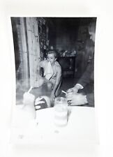 Vintage 1964 Party Girl Knealing Napkin in Teeth Snapshot Photograph picture
