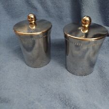 PAIR OF SILVER COLORED METAL CANDLE HOLDERS/LIDS AND CANDLES picture