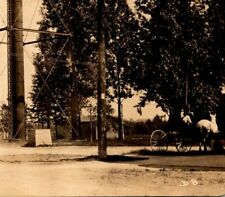 C.1919 RPPC Farwell, MI. Street Scene Water Tower Base Horse & Buggies Postcard picture
