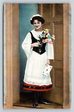 Woman w/ Flowers & Card Stands At Door Classic Fashion ANTIQUE Postcard picture