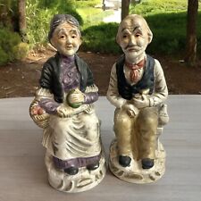 2 Collectible Ceramic Figurines, Seated Elderly Folks Woman W/ Yarn,Man w/ Pipe picture