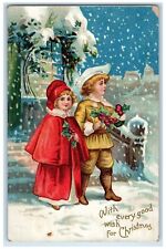 c1910's Christmas Children With Holly Berries Snowfall Winter Embossed Postcard picture