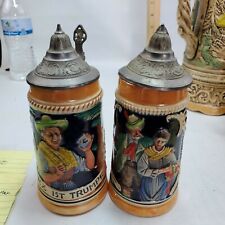 Pair Of Vintage  Raised Relief Gertz Beer Steins w/ lifting lids picture