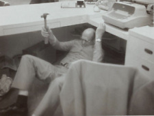 Man Holding Hammer Laying Under Desk With Typewriter B&W Photograph 3.5 x 4.25 picture
