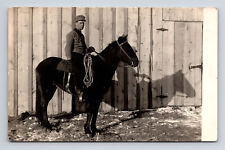 RPPC Young Man on Horse by Farm Door Winter? Real Photo Postcard picture