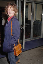 Bonnie Bedelia wearing a blue blazer over a red shirt with a tan l- Old Photo picture