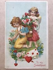 To My Sweetheart Boy Picks Flowers Cupid Has Basket Of Hearts Flowers Jan. 1909  picture