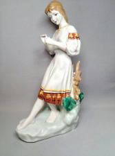 Porcelain figurine fortune-telling on a camomile picture