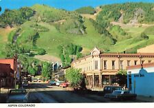 Postcard CO Aspen Mountain Rocky Mountains Cars Drug Store Street View Ski Trail picture