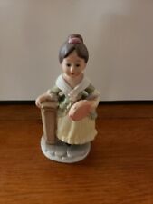 Old Woman Porcelain Figurine Holding Tamborine Leaning on Pedestal, Made Taiwan picture