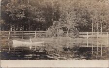 Real Photo Postcard Man in a Boat on a Lake in or near Oshkosh, Wisconsin~136611 picture