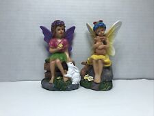 Small Yellow and Purple Winged Fairies Sitting in A Garden 5” Tall Set Of 2 picture