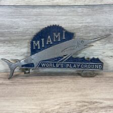 RARE 1950's Miami Beach Worlds Playground Metal License Plate Topper Marlin Vtg picture