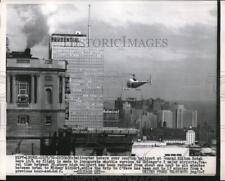 1956 Press Photo Helicopter Hovers Over Rooftop of Conrad Hilton Hotel picture