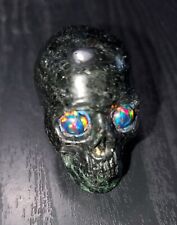 Rubilite Skull with Synthetic Black Opal Eyes picture