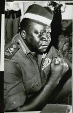 Idi Amin tied his fist during a speech to Gener... - Vintage Photograph 791509 picture