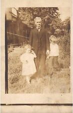 RPPC Real Photo Postcard Father and Two Children Holding Hands Backyard Garden picture