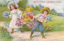 EASTER - Dressed Up Children Carrying Basket Of Chicks and Flowers Postcard-1911 picture