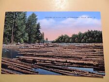 International Falls Minnesota vintage linen postcard Logging on Rainy Lake picture