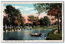 1920 Scene In Liberty Park Canoeing Tree Scene Sedalia MO Posted Bridge Postcard picture