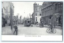 c1905 River Street Riding Bicycle Trolley Establishments Manistee MI Postcard picture