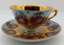 Antique Bavarian Hand Painted Cup & Saucer with Courting Couple, Heavily Gilded picture