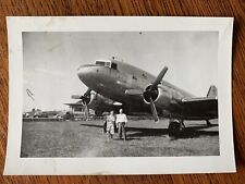 Douglas DC 3 ? airplane prop propeller plane airport or static display old cars picture