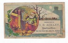 1800's Adver. Trade Card D.B. Ackley Bookseller - Green Coat Santa picture