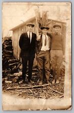 RPPC Three Handsome Men Standing by Wood Shed Postcard picture