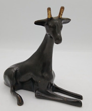 Vintage Solid Brass/Metal Calf/Giraffe Resting/Laying Down Black w/ Golden Horns picture