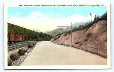 LOOKOUT PASS, ID Idaho/Montana ~ RAILROAD CARS & Road Scene c1920s Postcard picture
