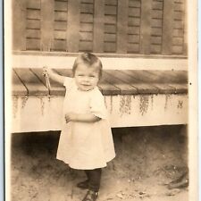 c1910s Adorable Baby Outdoors Smile RPPC w/ Clothespin Real Photo PC House A185 picture