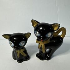 Left in black and gold cat salt and pepper shakers jeweled eyes picture