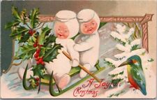 Vintage 1910s MERRY CHRISTMAS Embossed Postcard Children on Snow Sled / Bird picture