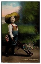 Antique Little Boy with State of WV in Wheelbarrow, Wheeling, WV Postcard picture