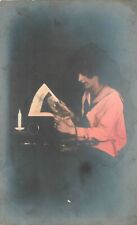 Postcard RPPC hand Tint woman reading newspaper 23-1280 picture