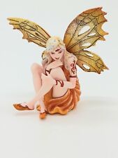 Yellow Orange Spring Sun Fairy Sitting in Wonderment / Collectible Figurine picture