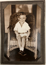 Vintage RPPC Sepia Photo of a Young Boy In Wicker Chair Trimmed & Glued In Mat picture