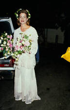 Claudia Christian wearing a wedding dress holds a bouquet 1980s Old Photo 1 picture