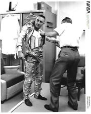 Gus Grissom getting dressed in his space suit in Washington picture